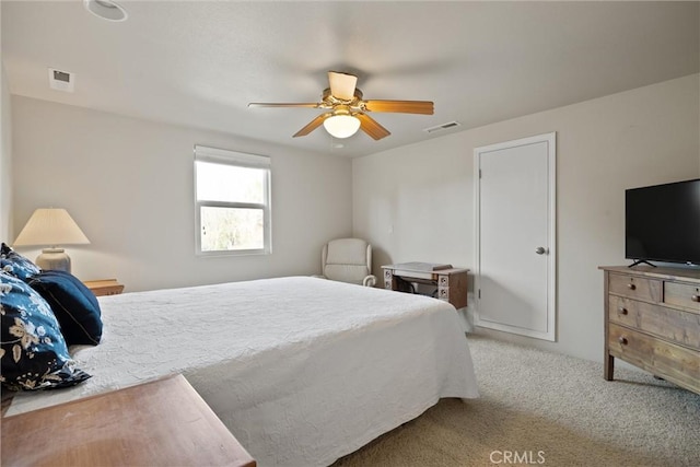 bedroom featuring light colored carpet and ceiling fan