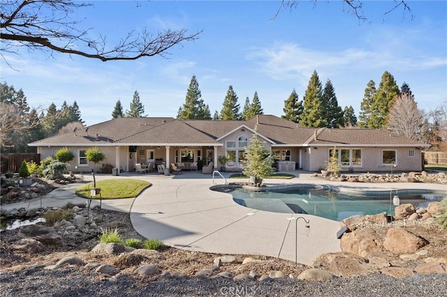 view of swimming pool with a patio