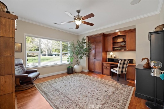 office space with ornamental molding, hardwood / wood-style floors, and ceiling fan