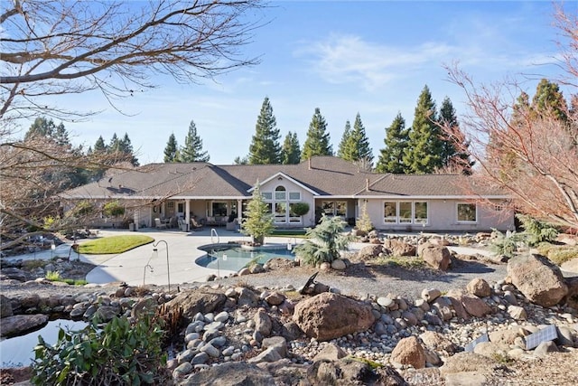 back of property featuring a patio area