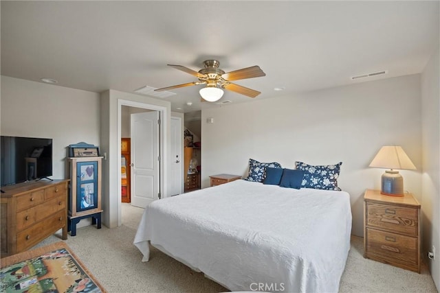 bedroom featuring light carpet and ceiling fan