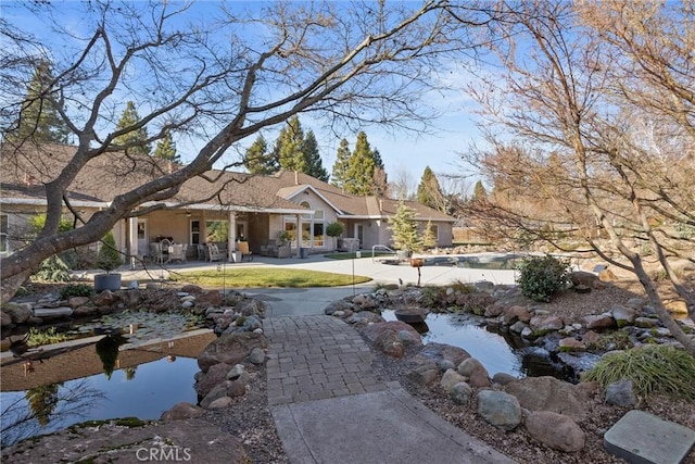 back of property featuring a patio