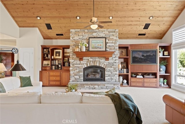 carpeted living room featuring wood ceiling, a stone fireplace, high vaulted ceiling, and ceiling fan