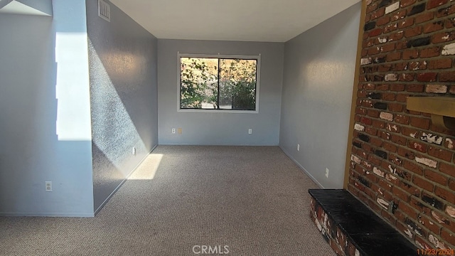 unfurnished room with light colored carpet