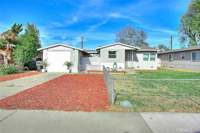 view of front of property featuring a garage and a front yard