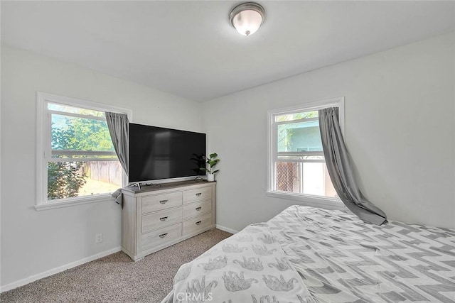 bedroom with light carpet