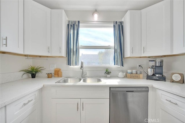 kitchen featuring white cabinetry, sink, and stainless steel dishwasher