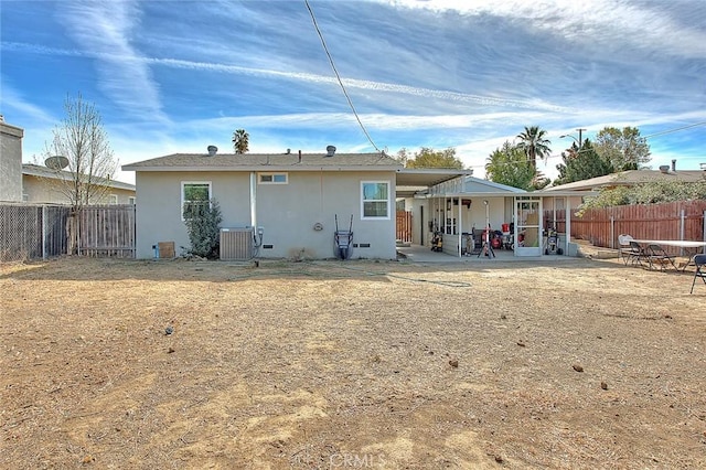 back of house with a patio