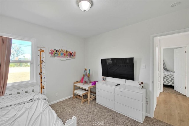 bedroom with light hardwood / wood-style floors