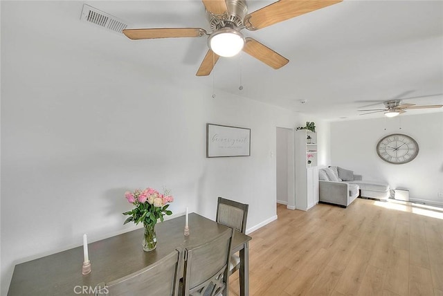 dining room featuring ceiling fan and light wood-type flooring