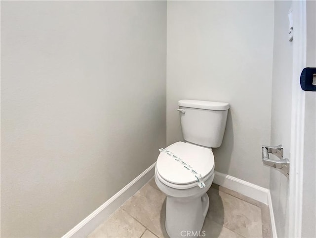 bathroom with tile patterned floors and toilet