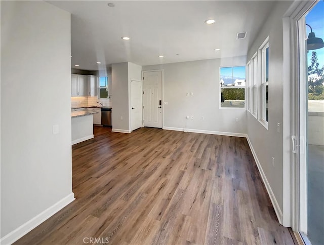 unfurnished living room featuring light hardwood / wood-style floors