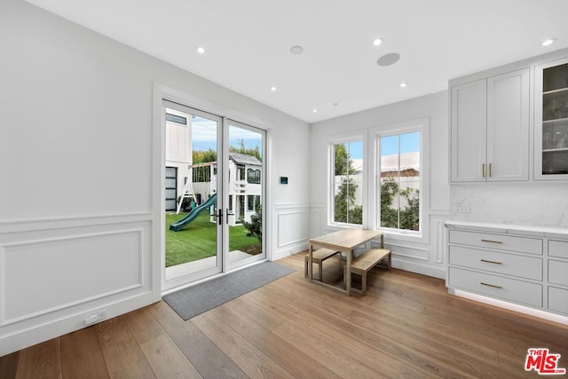 entryway with plenty of natural light and light hardwood / wood-style flooring