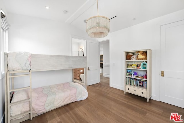 bedroom featuring vaulted ceiling with beams, a notable chandelier, and dark hardwood / wood-style flooring