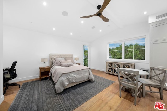 bedroom featuring lofted ceiling, light hardwood / wood-style flooring, and ceiling fan