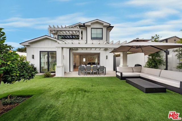 back of property featuring an outdoor living space, a yard, a pergola, and a patio area