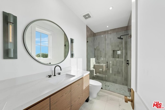 bathroom featuring vanity, toilet, and walk in shower