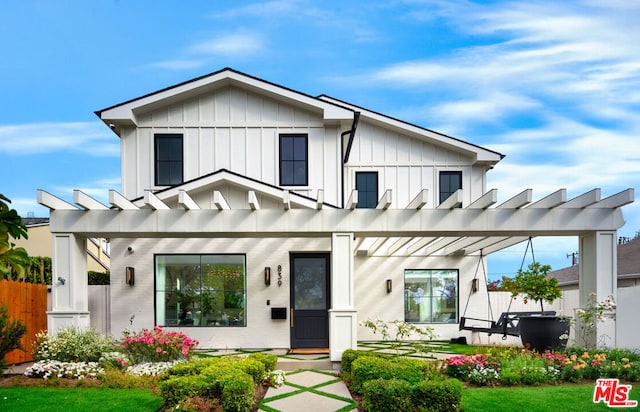 modern inspired farmhouse with a pergola