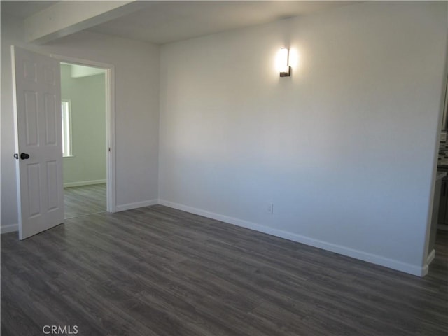 unfurnished room featuring dark hardwood / wood-style floors