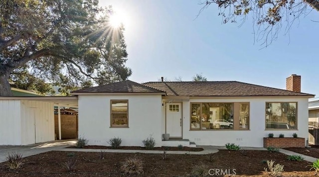 view of front of house featuring a carport