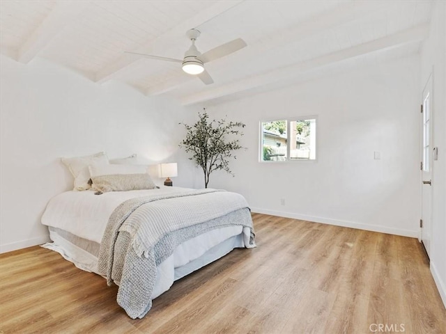 bedroom with beamed ceiling, light hardwood / wood-style floors, and ceiling fan