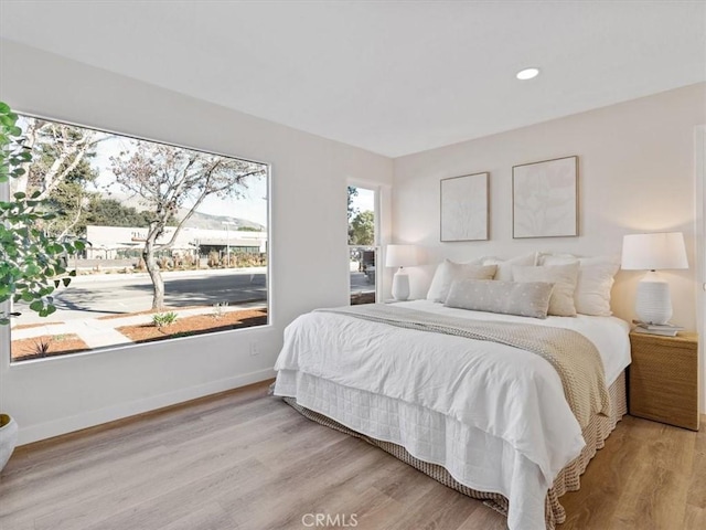 bedroom with light wood-type flooring