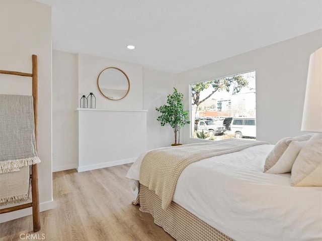 bedroom featuring light hardwood / wood-style floors