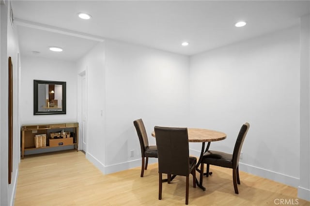 dining area with light hardwood / wood-style floors