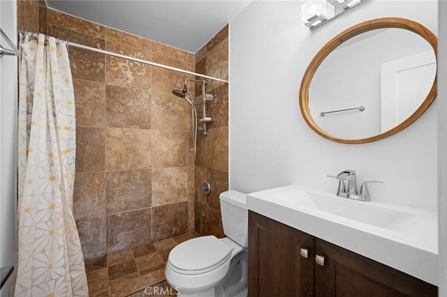 bathroom with walk in shower, vanity, and toilet