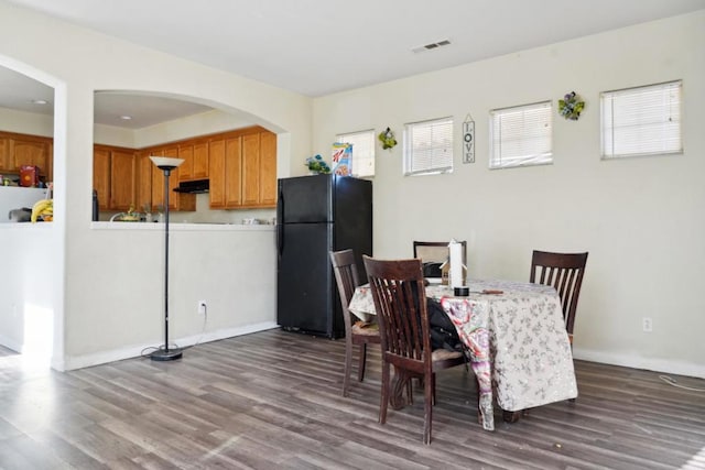 dining space featuring hardwood / wood-style flooring