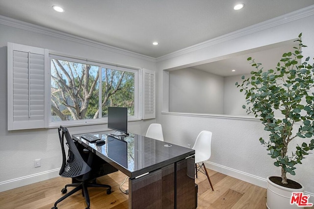 home office featuring crown molding and light wood-type flooring