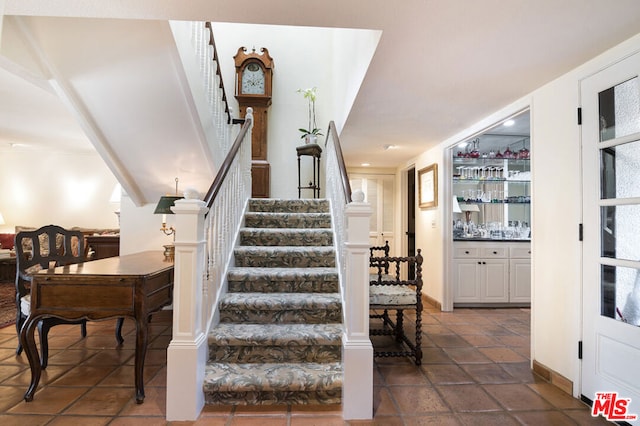 stairs featuring bar area