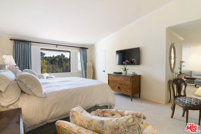 bedroom with lofted ceiling, light carpet, and ornamental molding