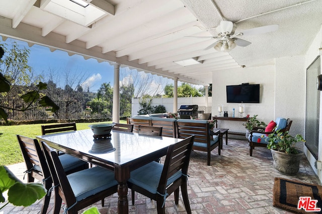 view of patio / terrace with outdoor lounge area, a grill, and ceiling fan