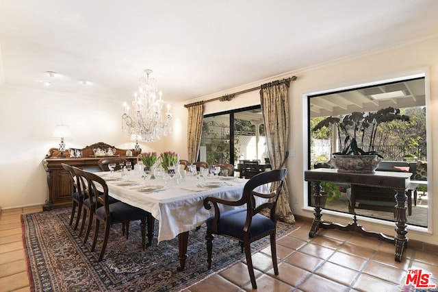 tiled dining space with crown molding and a chandelier