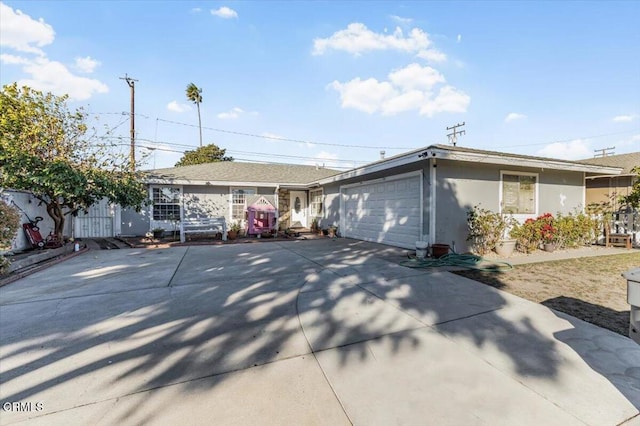 ranch-style house featuring a garage