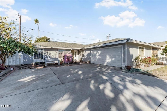 ranch-style house featuring a garage