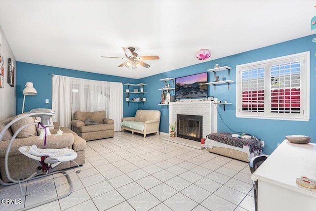 tiled living room featuring ceiling fan and a fireplace