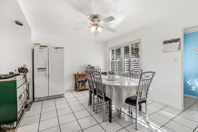 dining room featuring light tile patterned floors and ceiling fan