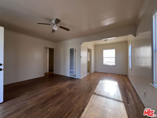 spare room featuring crown molding, ceiling fan, and dark hardwood / wood-style flooring