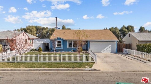 ranch-style home featuring a garage and a front yard