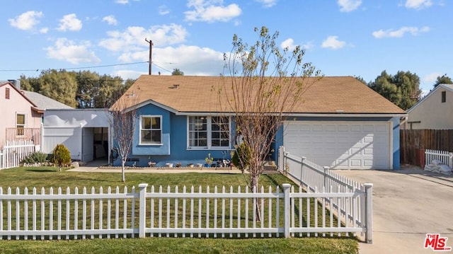 ranch-style house with a garage and a front yard