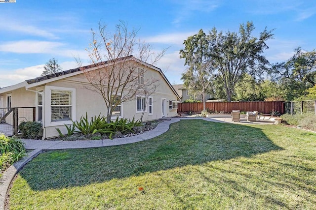 view of home's exterior featuring a patio and a yard