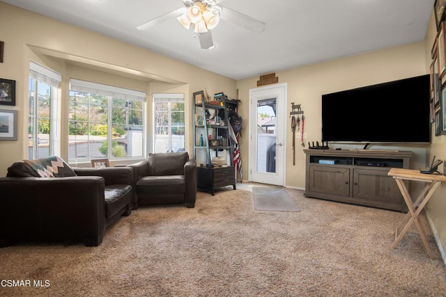 living room with light colored carpet and ceiling fan