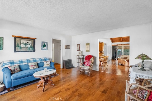 living room featuring hardwood / wood-style flooring and a textured ceiling