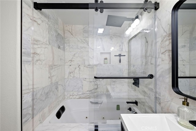 bathroom with shower / bath combination with glass door and sink