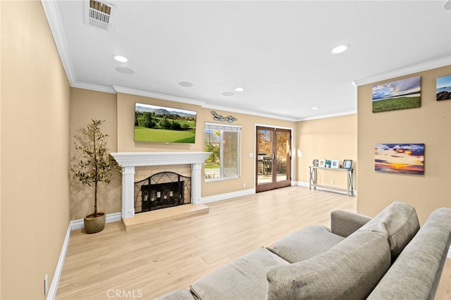 living room with ornamental molding and hardwood / wood-style floors