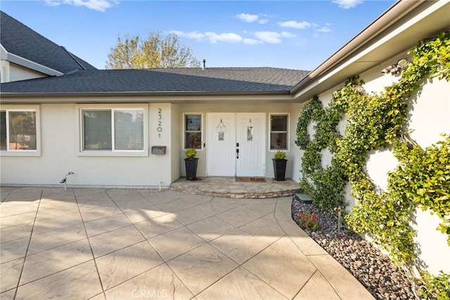 property entrance with a patio area