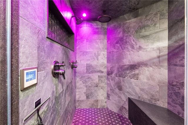 bathroom with a tile shower