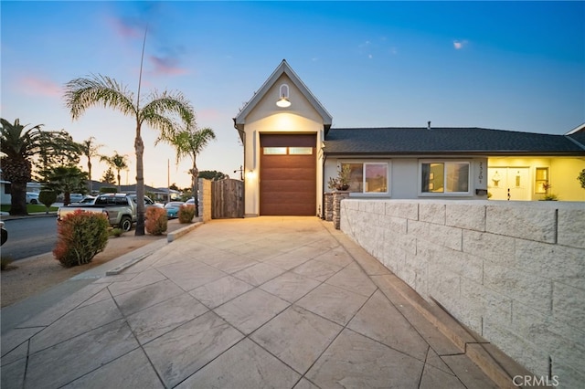 single story home with a garage